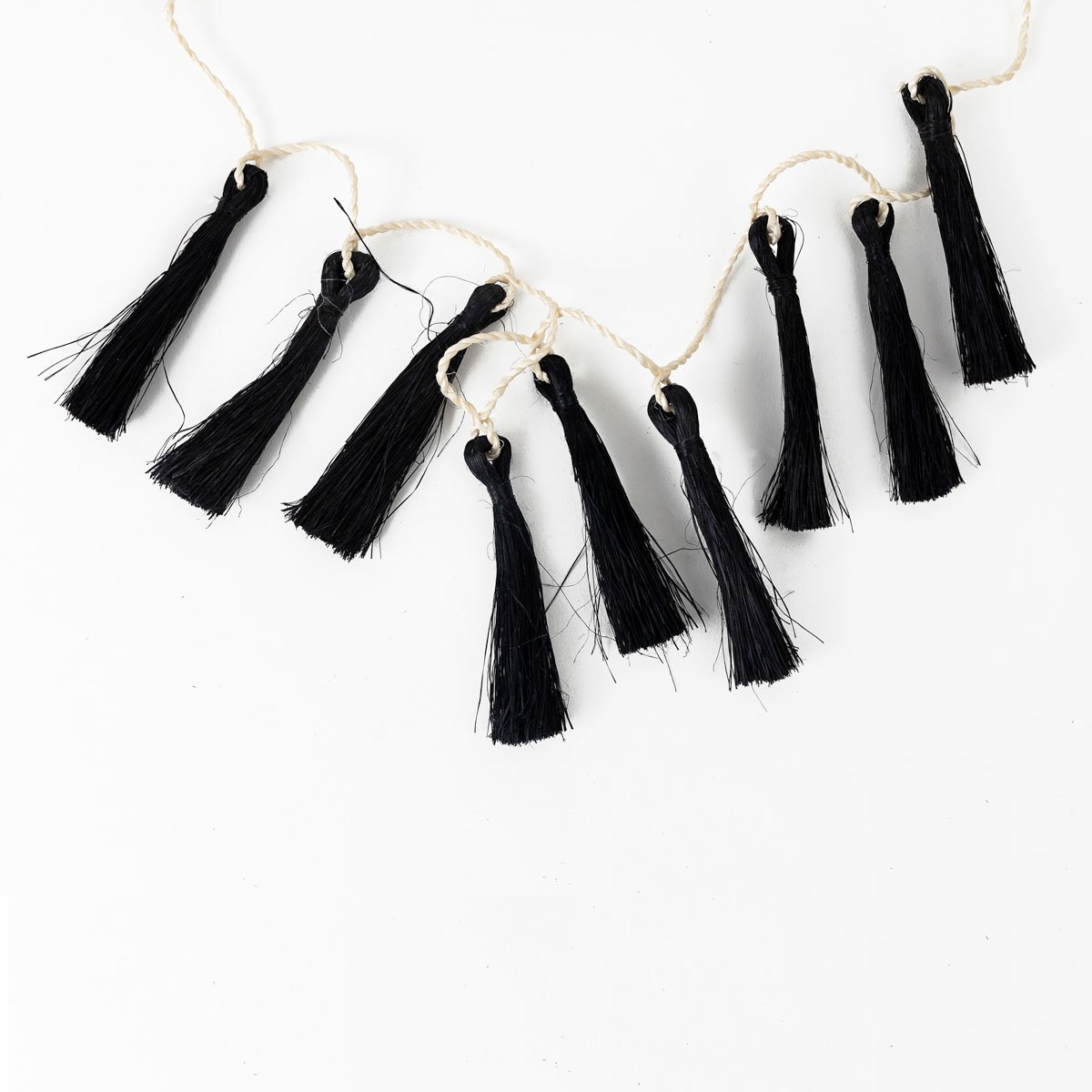 Macy-White-Sutton-Onyx-Tassels-White-Background-1